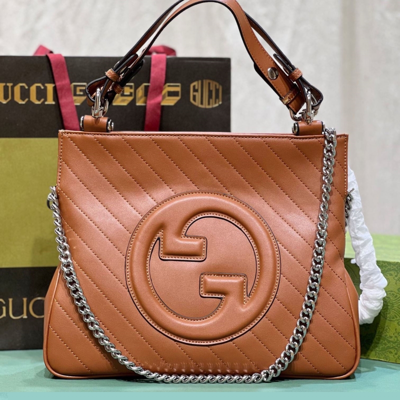 G*u*i shopping bags